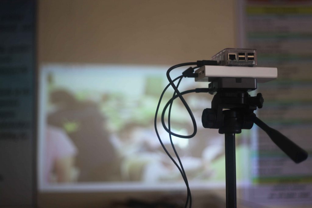 Projector showing learning materials on a screen