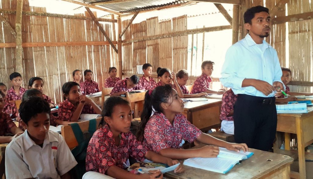 Teacher teaching in a rural community classroom