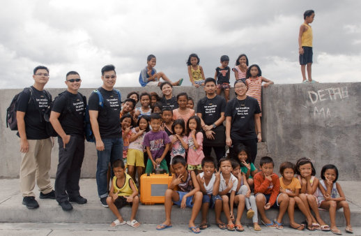 Group photo of The Patatas employees with the children in rural communities