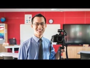 Screengrab of Eddie Woo's YouTube Channe;Man smiling with a camera